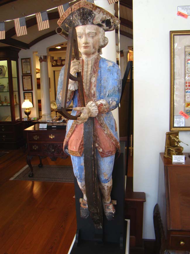 An exceptionally rare 18th century Ship Chandler's Trade Sign in the form of a French Naval Captain looking through his octant circa 1750. — image 2